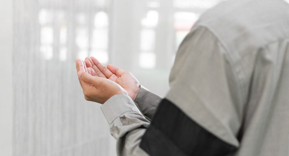 a man holding his hands together